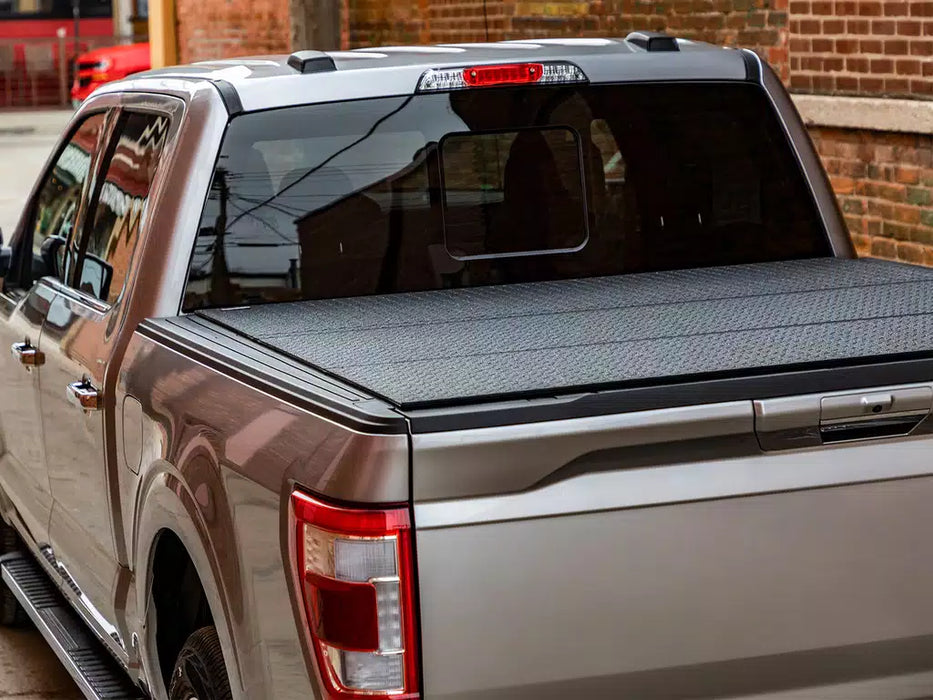 Access LOMAX Professional Series Hard Folding Tonneau Cover For 2017-2024 Nissan Titan 5'7" Bed - B0030019